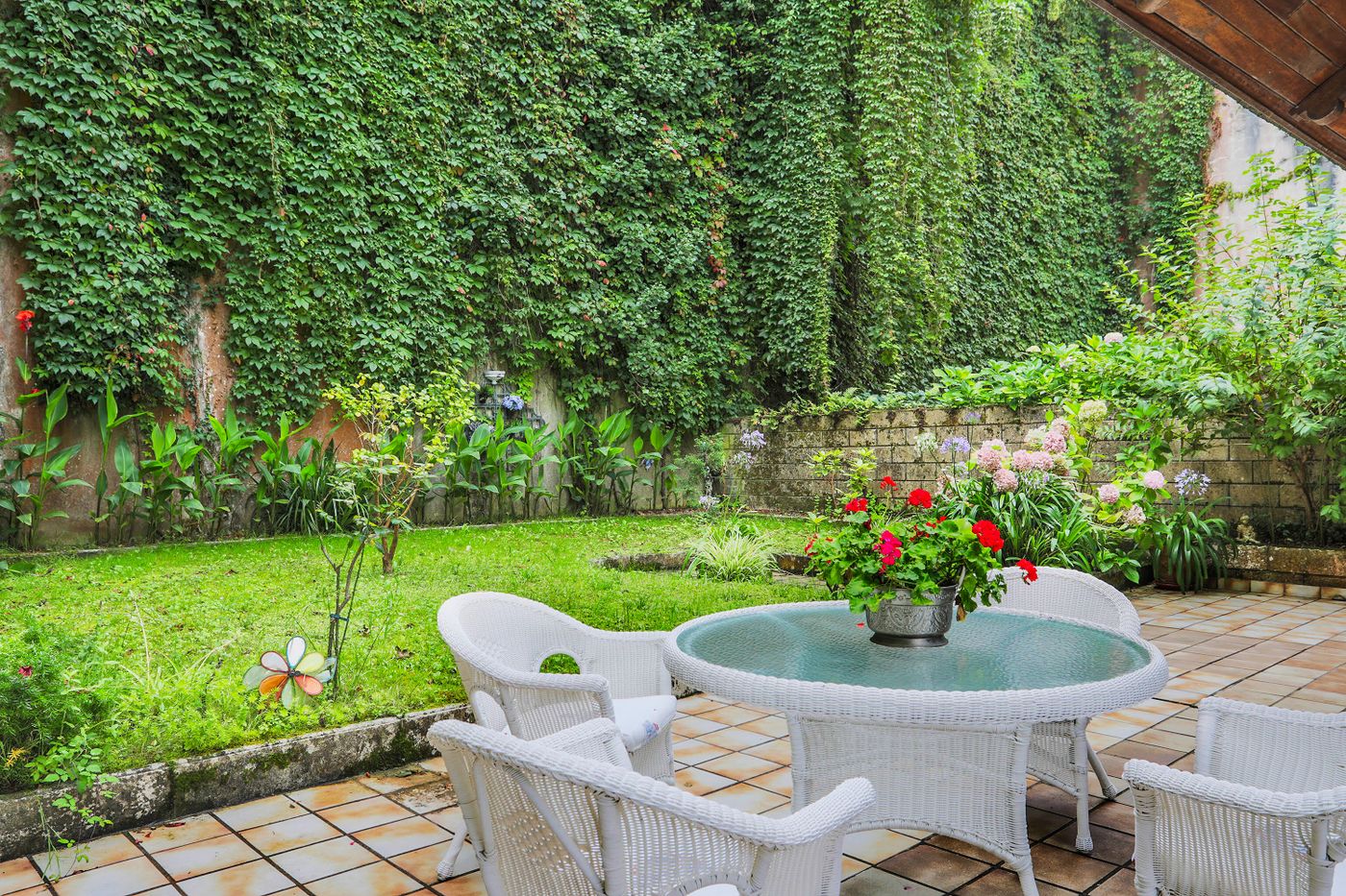 Garden patio surrounded by planting — illustrative stock photograph