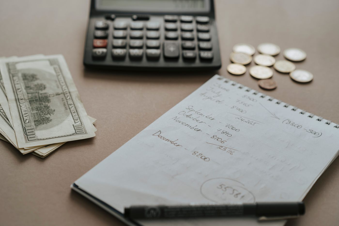 Notebook and financial planning workspace — illustrative stock photograph