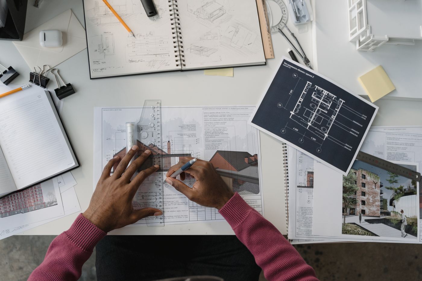 Architect reviewing designs and layouts — illustrative stock photograph